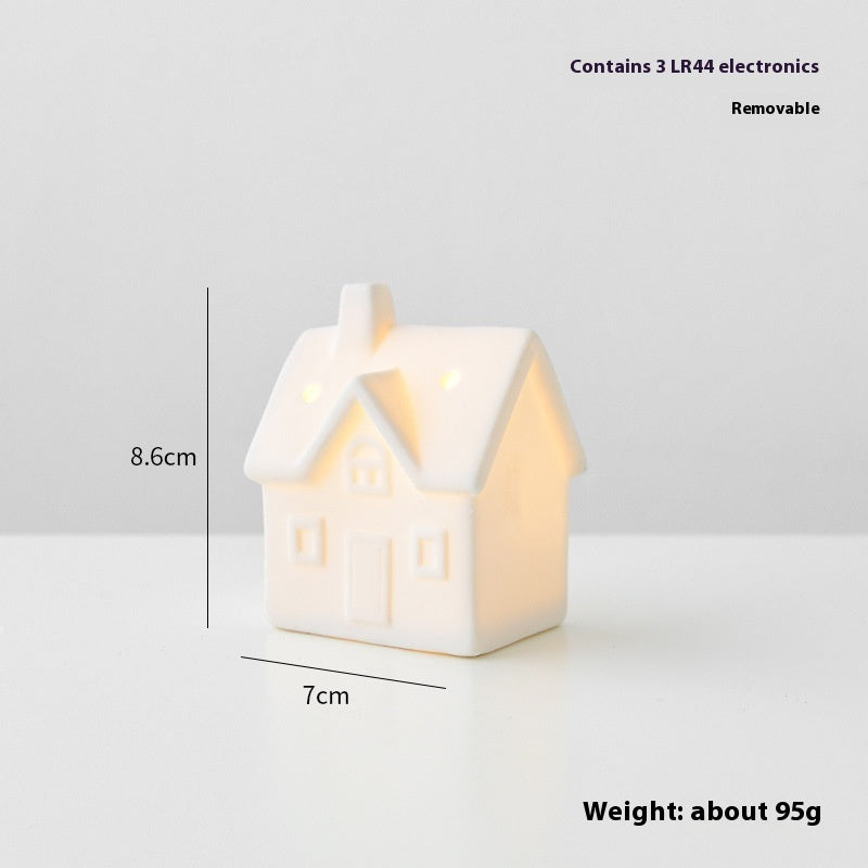 White house-shaped night light with measurements and weight information on a light gray background