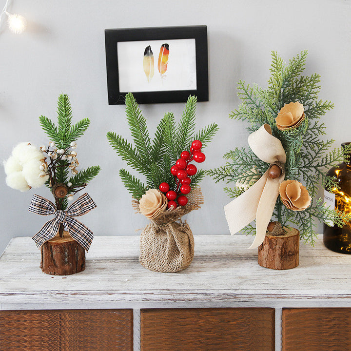 Decorative floral arrangements on wooden logs with a framed picture in the background.