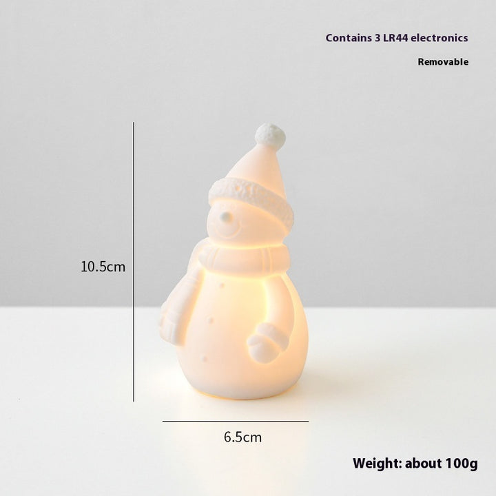 Snowman-shaped night light with measurements and weight information on a white background