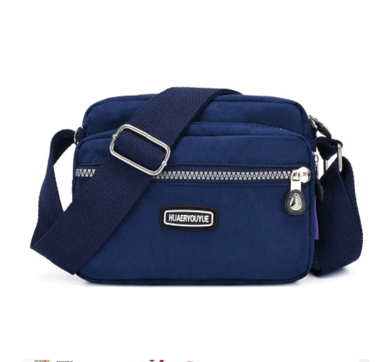 Women's Compact Multi Compartment Messenger Bag in Dark Blue | Confetti Living