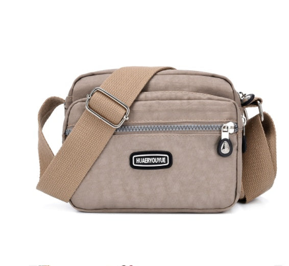 Women's Compact Multi Compartment Messenger Bag in Beige | Confetti Living
