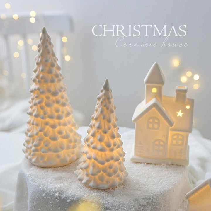 Ceramic Christmas tree and house with snow effect on a white background