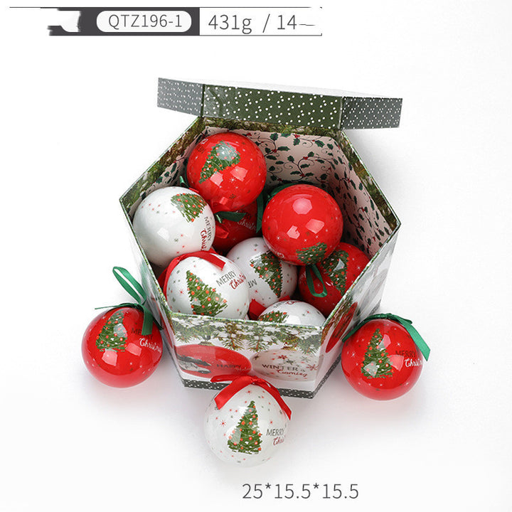 Box of Christmas-themed ornaments with red and white designs on a white background