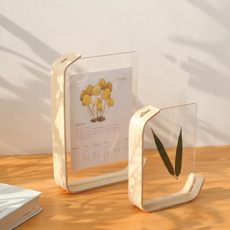 Wooden bookends with clear acrylic panels on a wooden surface