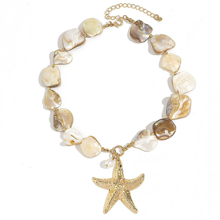 Necklace with shell beads and a gold starfish charm on a white background