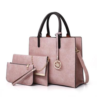 A set of three pink leather bags including a tote bag, a shoulder bag, and a purse with a chain strap, all displayed against a white background.