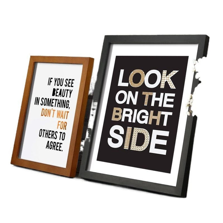 Two framed prints with motivational quotes on a white background