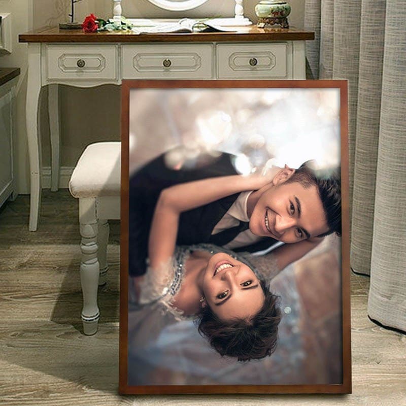 Framed photograph of a couple posing together indoors.