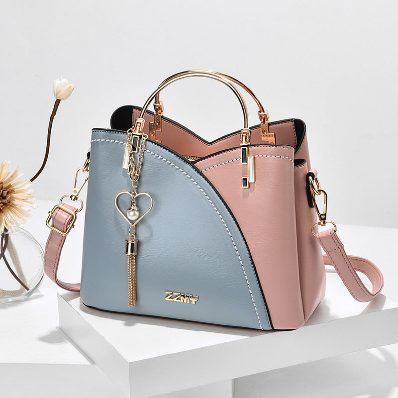 Women's Colour Block Handbag with Love Tassel showing Blue with Pink | Confetti Living