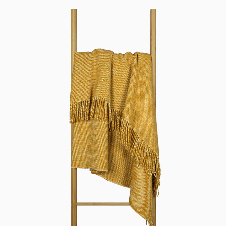 Cambridge Throw Rug -  Mustard shown in situation | Confetti Living