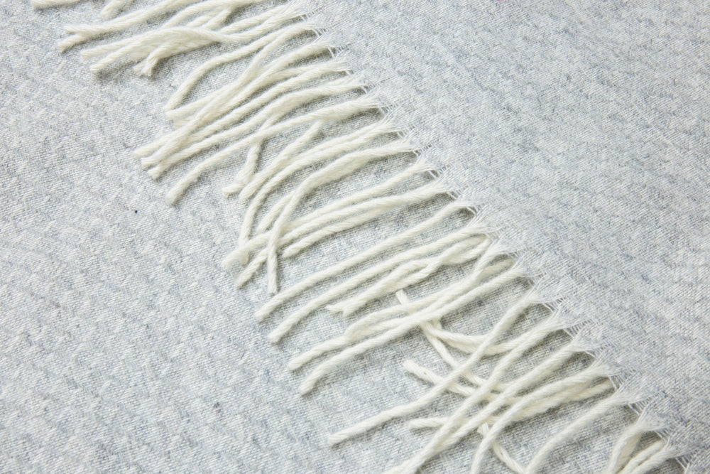Chiswick Light Grey Merino Throw Blanket showing fringe detail | Confetti Living