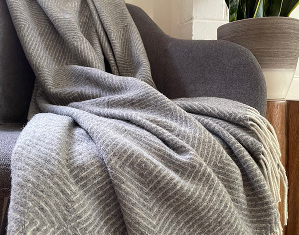 Hampton Light Grey Merino Wool Throw Rug showing product in use | Confetti Living