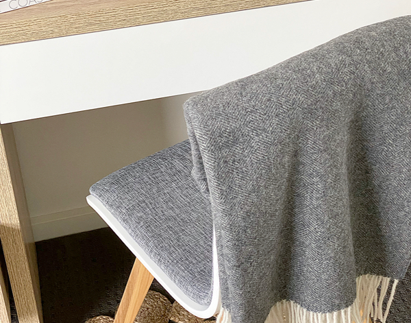 Hampton Dark Grey Merino Wool Throw Rug showing product in use | Confetti Living
