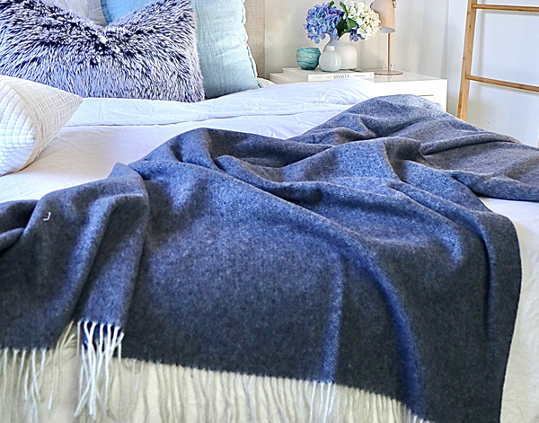 Kensington Wool Throw Rug in Navy shown in use | Confetti Living
