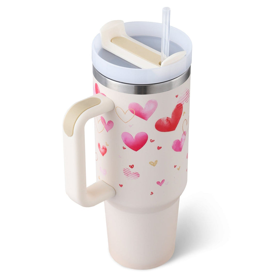 White tumbler with heart designs on a white background