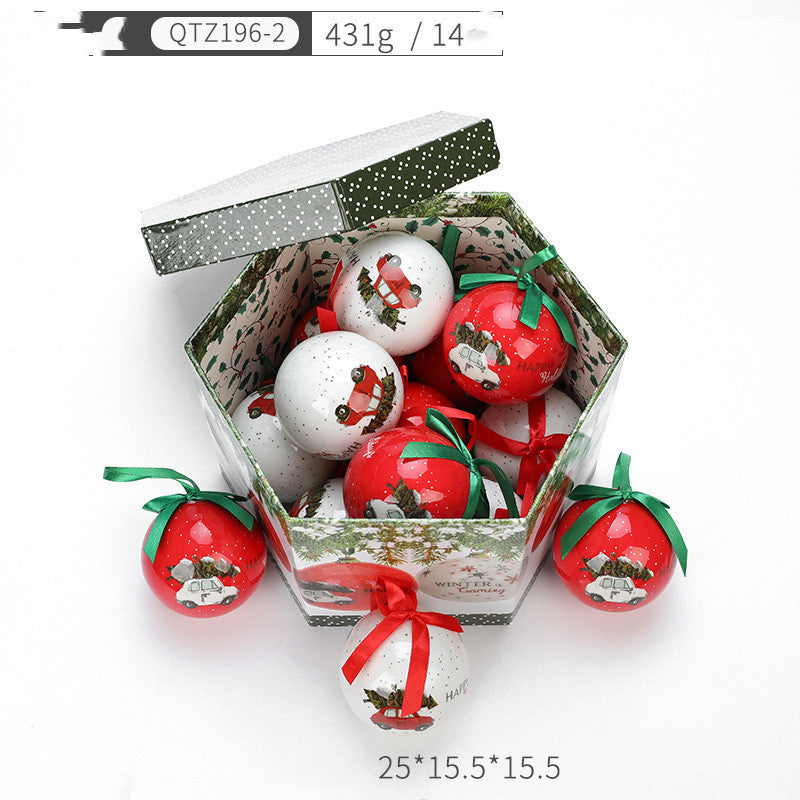 Decorative balls with tomato design in a box on a white background