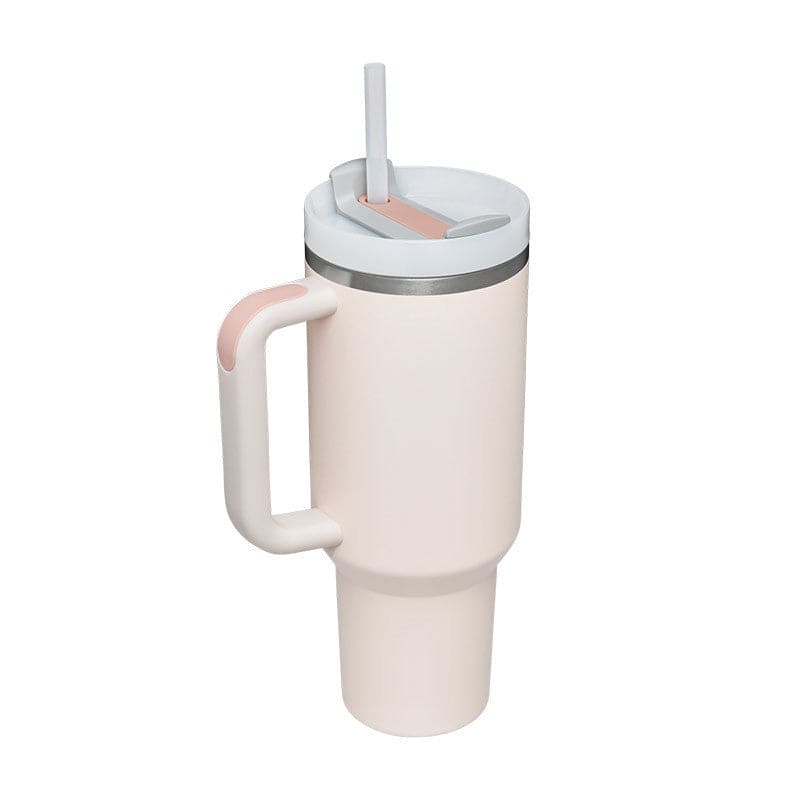 White tumbler with a handle and straw lid on a white background