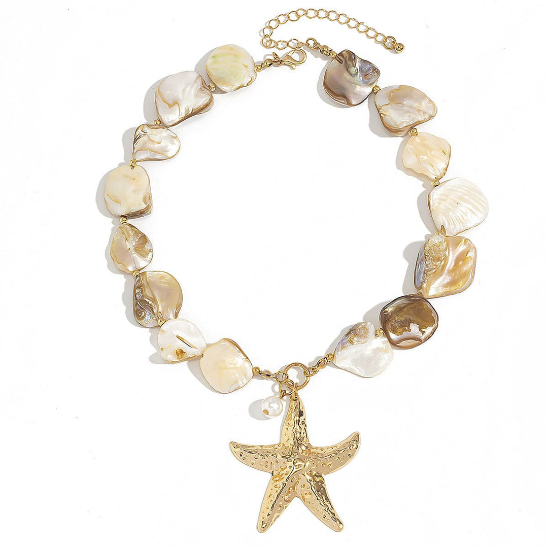 Necklace with shell beads and a gold starfish charm on a white background
