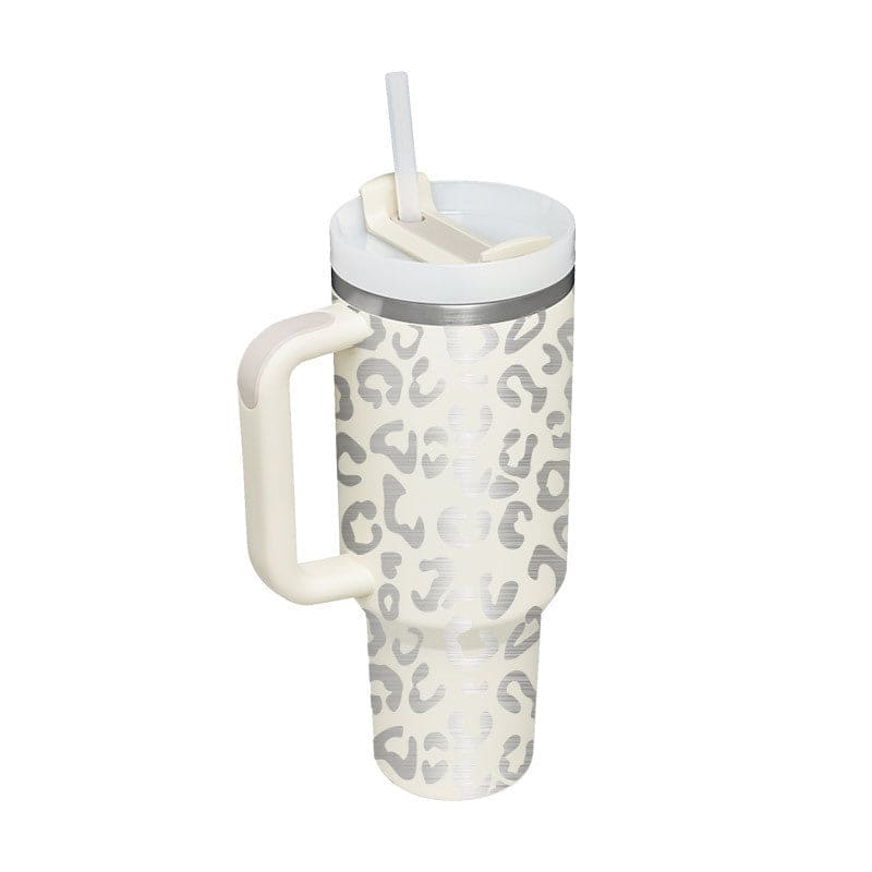 Tumbler with leopard print design and handle on a white background