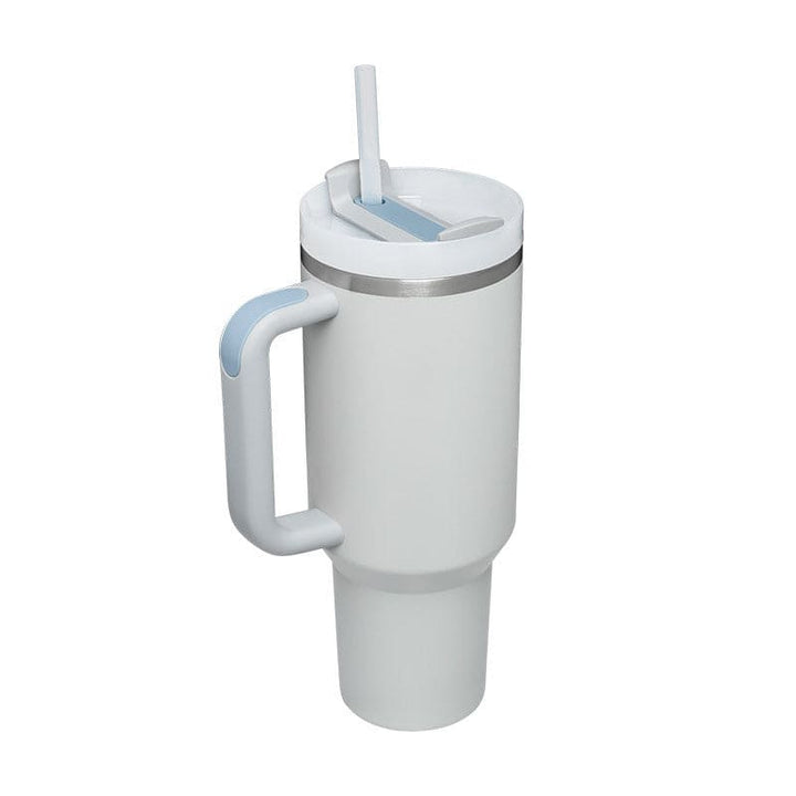 White tumbler with a handle and straw on a white background