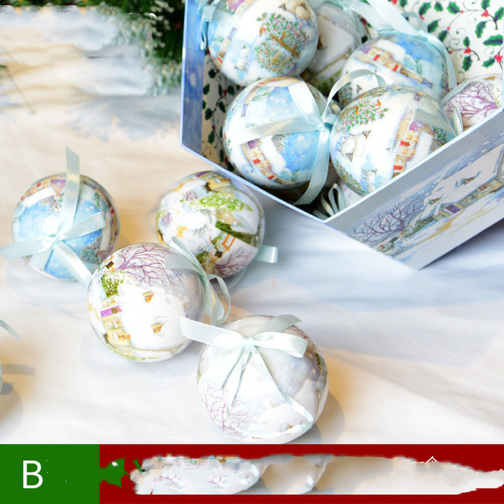 Decorative Christmas balls with ribbons in a box on a white surface
