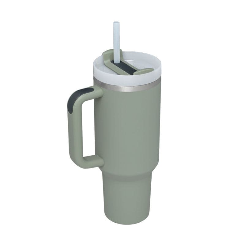 Green tumbler with a handle and straw lid on a white background