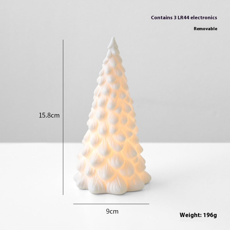 White ceramic Christmas tree-shaped lamp with measurements and weight information on a light gray background