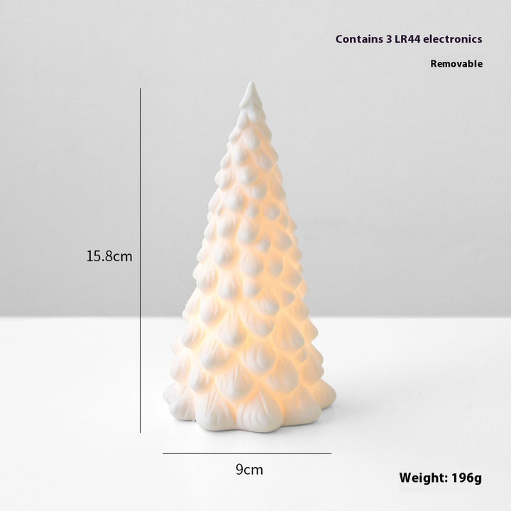 White ceramic Christmas tree-shaped lamp with measurements and weight information on a light gray background
