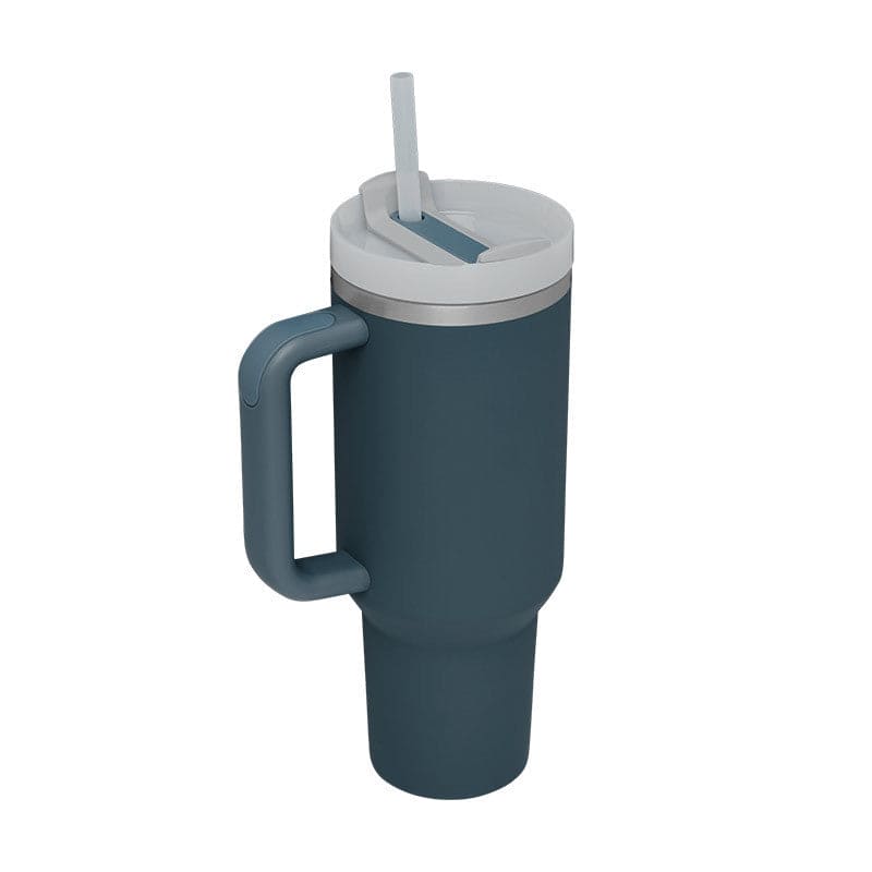 Blue insulated mug with handle and straw lid on a white background