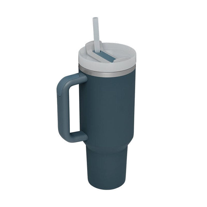 Blue insulated mug with handle and straw lid on a white background