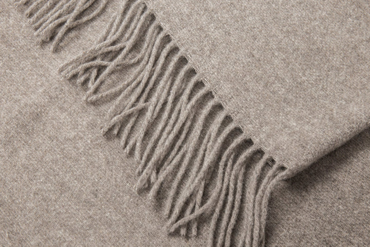 Chiswick Stone Merino Throw Blanket showing product fringe details | Confetti Living