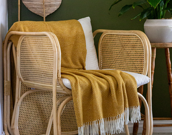 Hampton Mustard Merino Wool Throw Rug showing product in use | Confetti Living