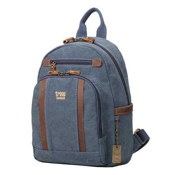 Classic blue small backpack from Troop London is a smaller two compartment backpack with a padded compartment for your tablet/iPad and could be your alternative for a handbag. Angled orientation.