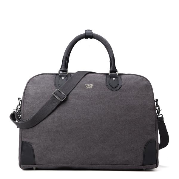 Classic charcoal large holdall bag from Troop London has a very spacious and deep main compartment which makes it an ideal weekend getaway holdall or everyday companion. Front facing orientation showing shoulder strap.