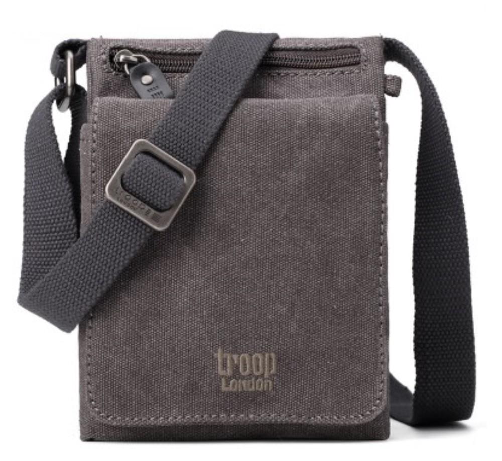 Classic charcoal body bag from Troop London is a funky, small lightweight shoulder bag perfect for traveling where you only wish to carry your essentials like passport, wallet, phone, pens, small travel guide book, and map. Front facing orientation showing shoulder strap.